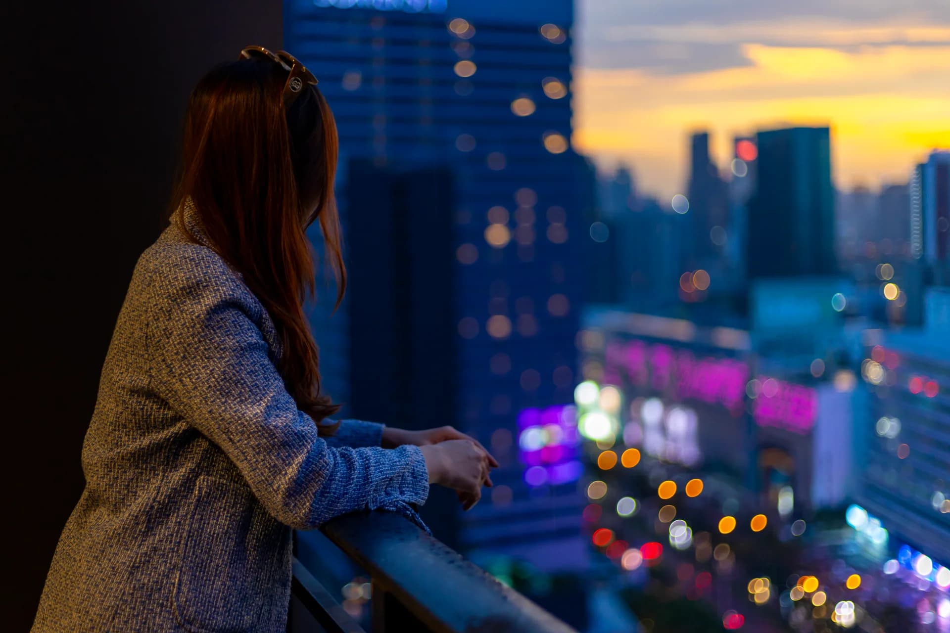 A modern condominium tower at night